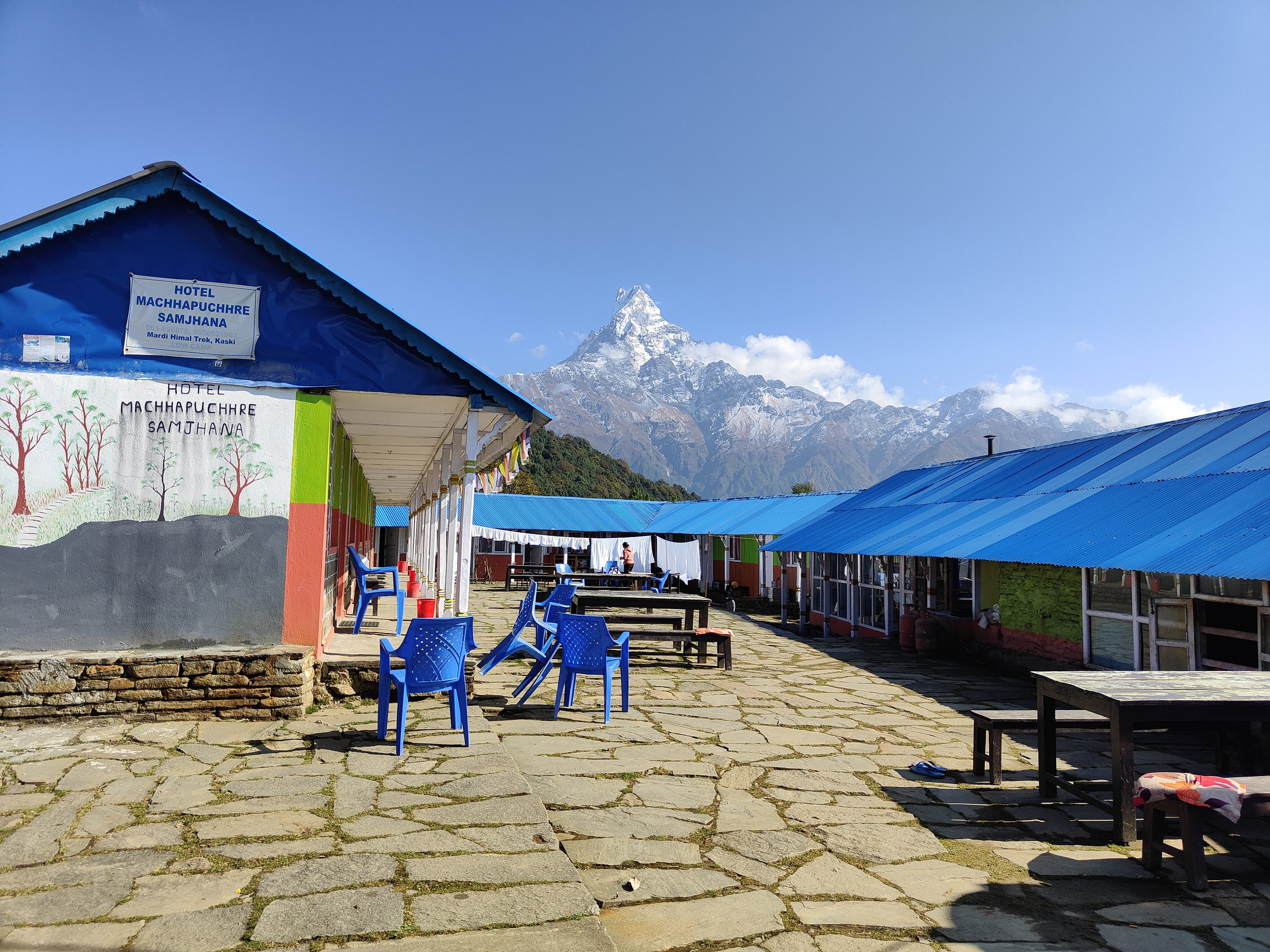 Colourful tea houses in Low Camp, set against the backdrop of Machhapuchhre