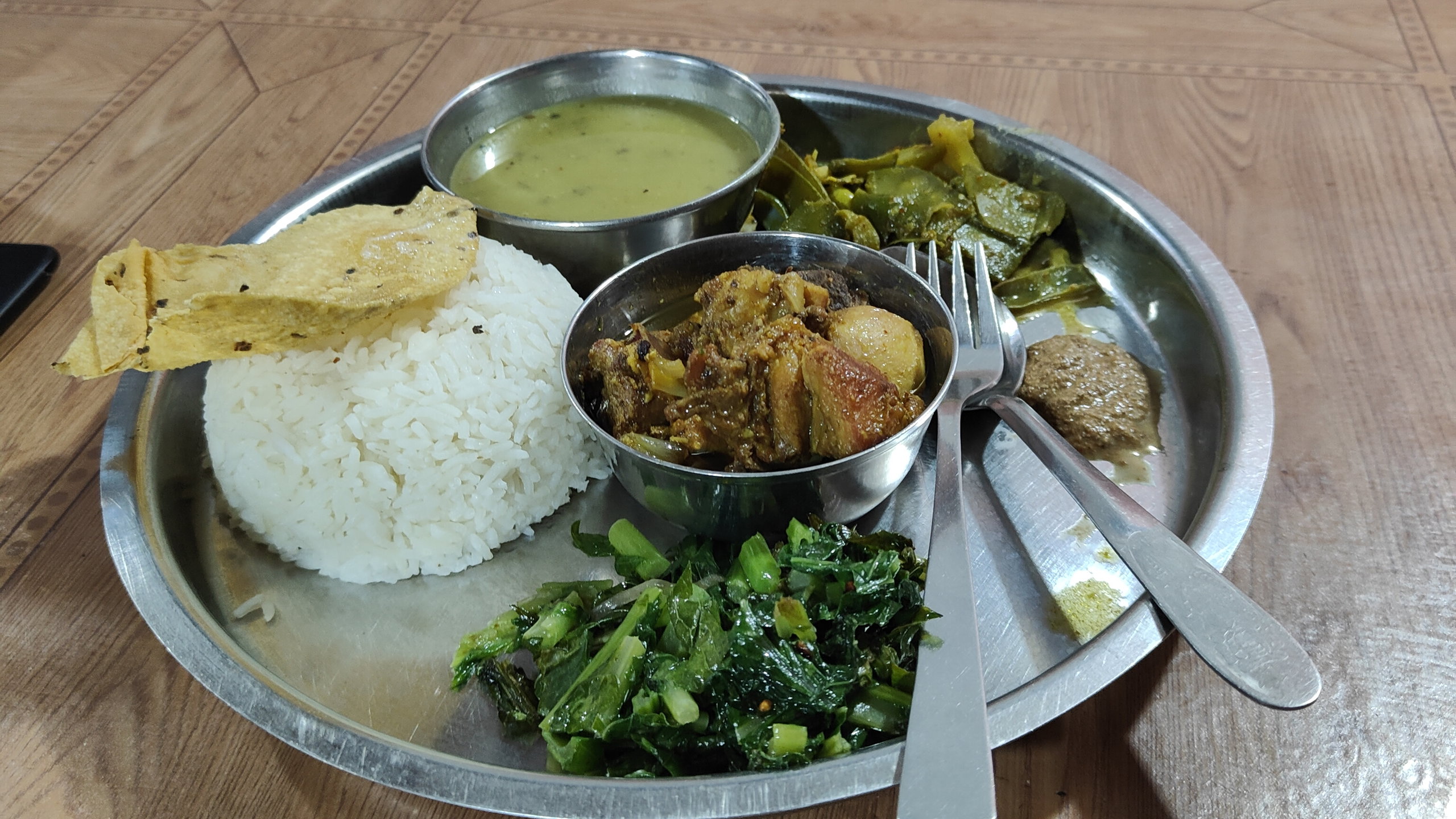 A Dal Baht dish with rice, dal and vegetables.