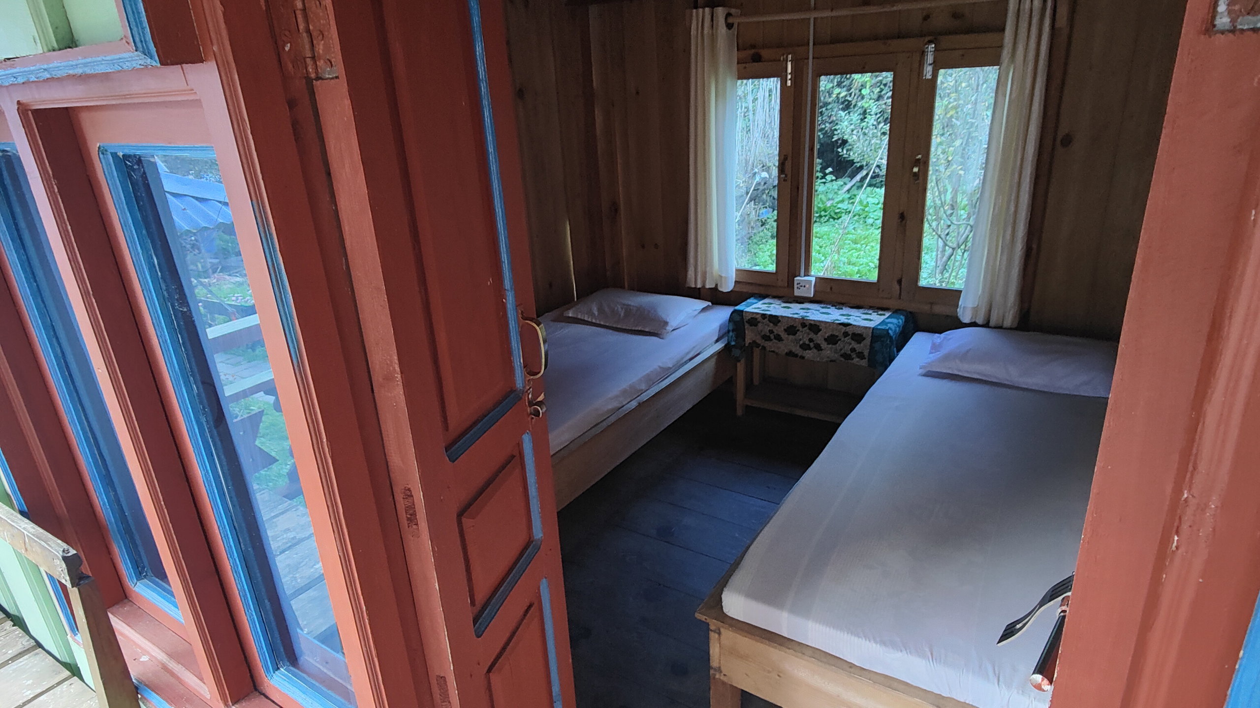 A small teahouse room with two single beds.